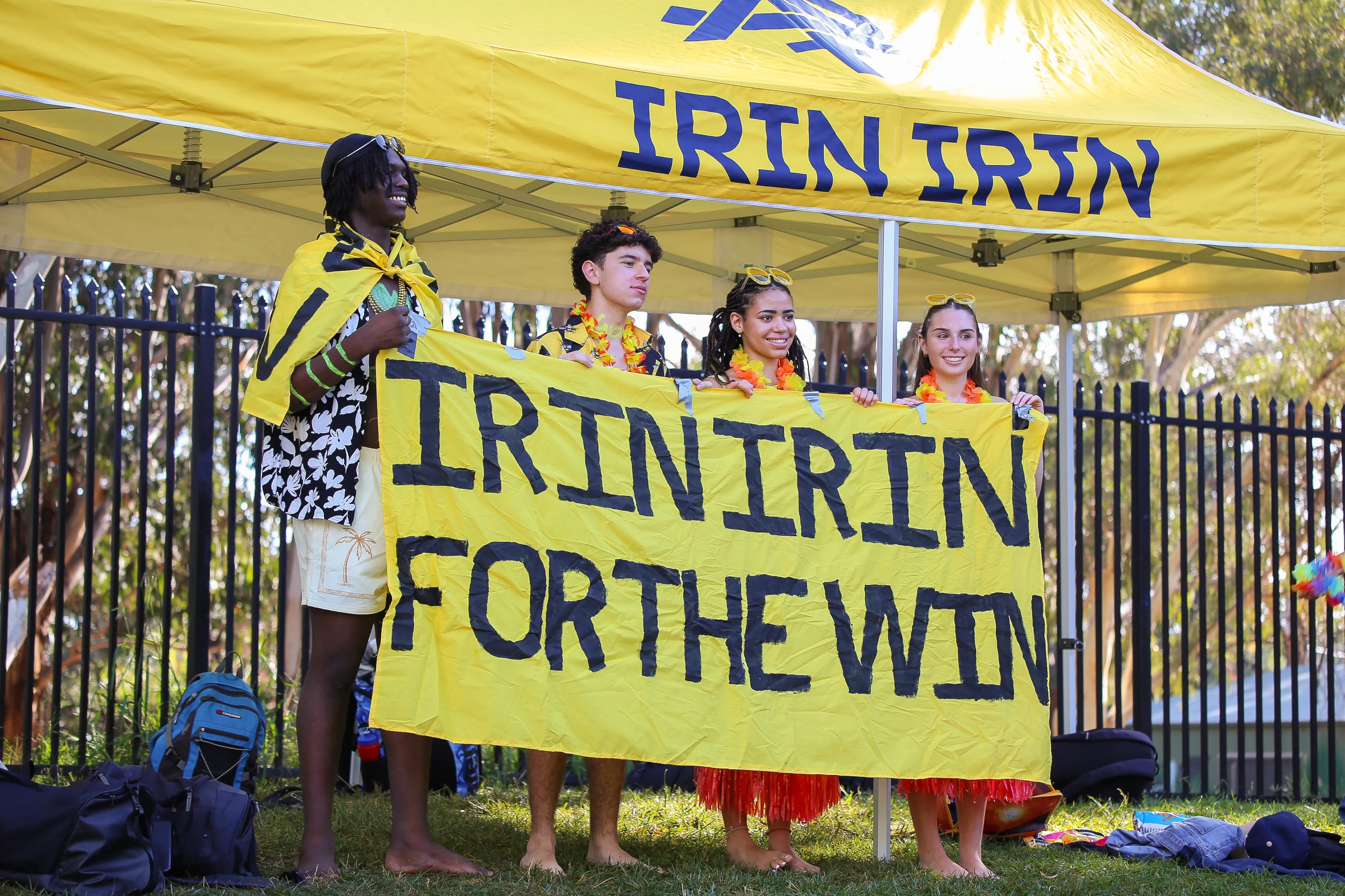 Four students holding a banner that says Irin Irin for the Win