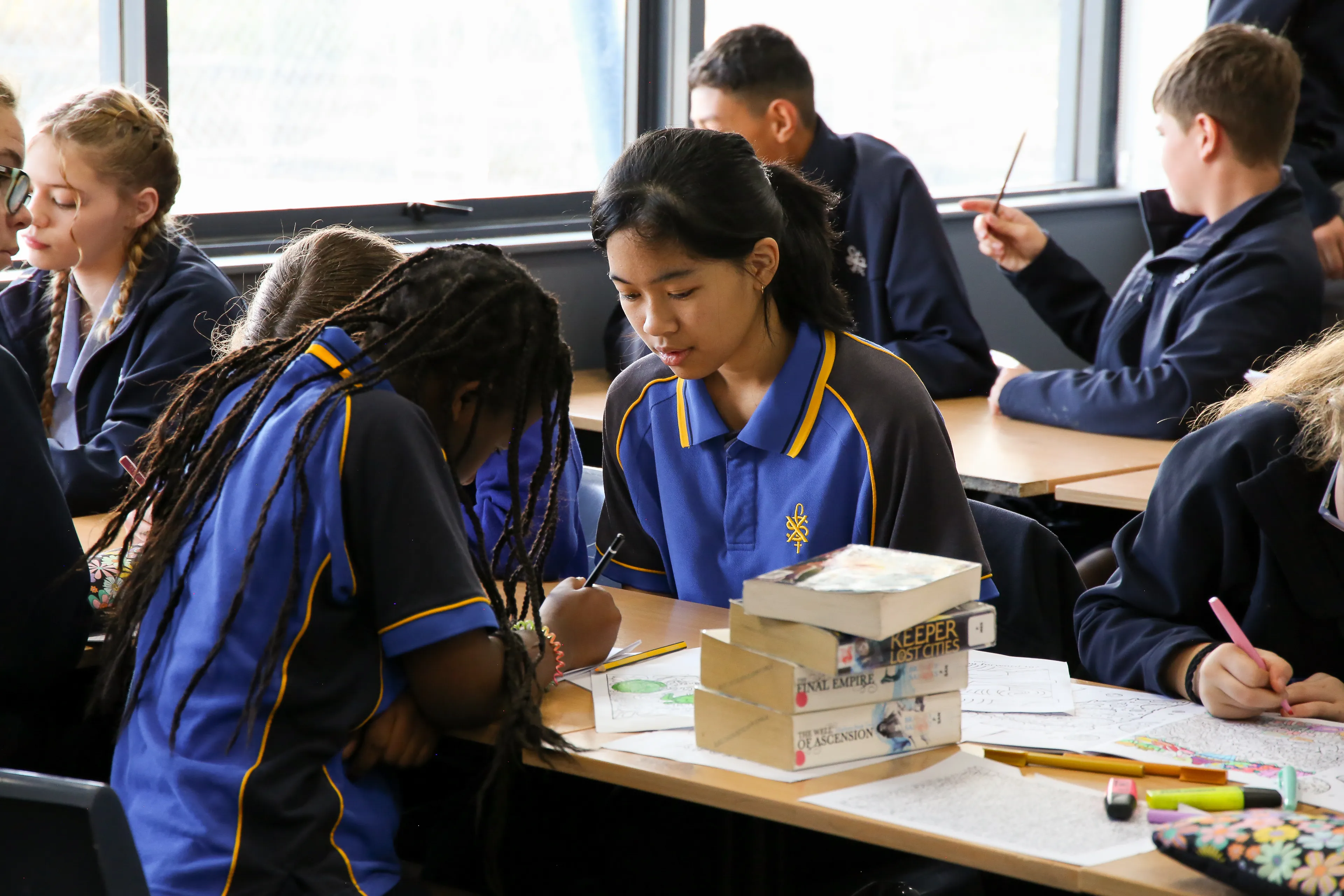Two female students interacting in class