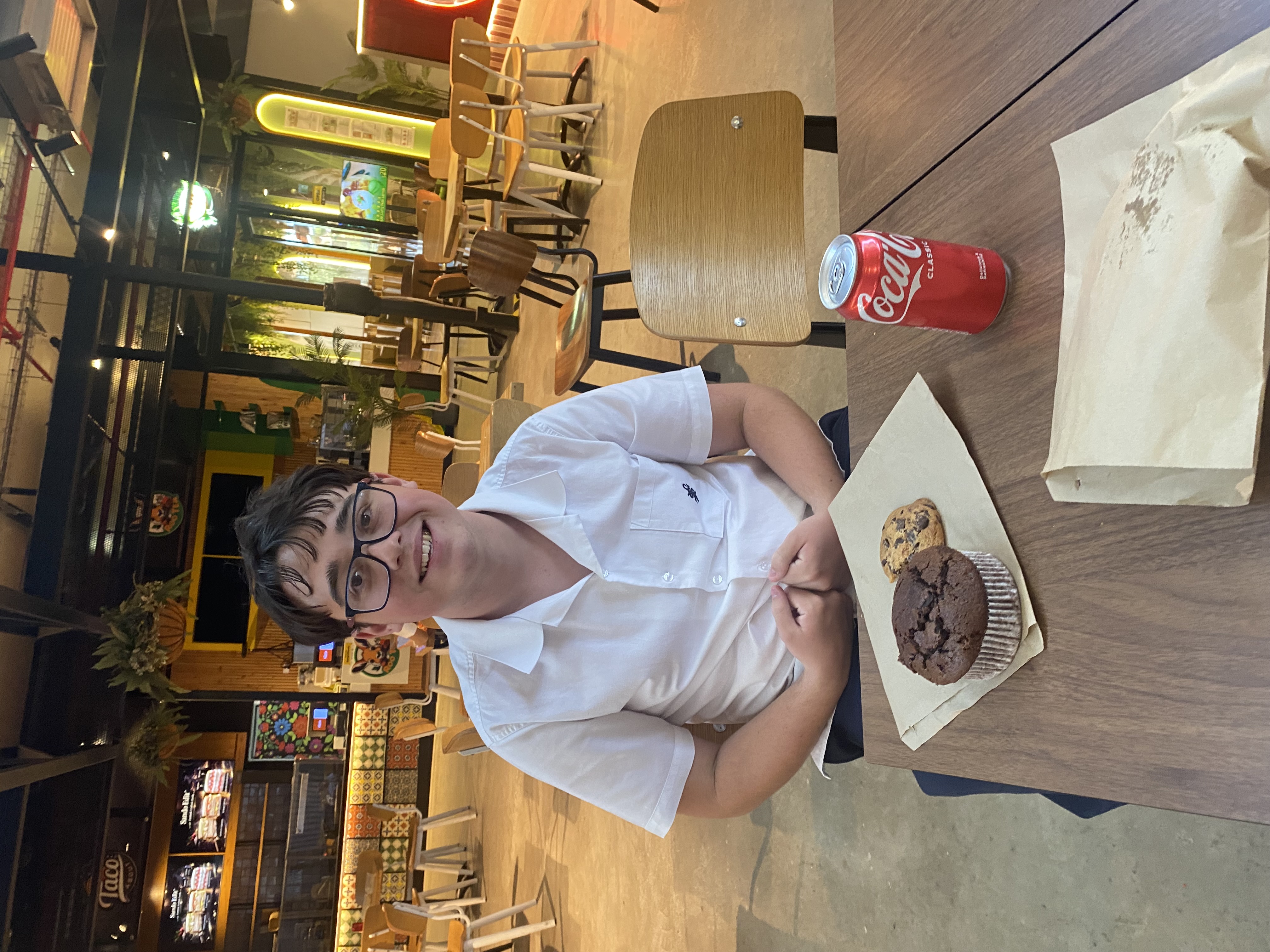 SFX Student enjoying food from the markets